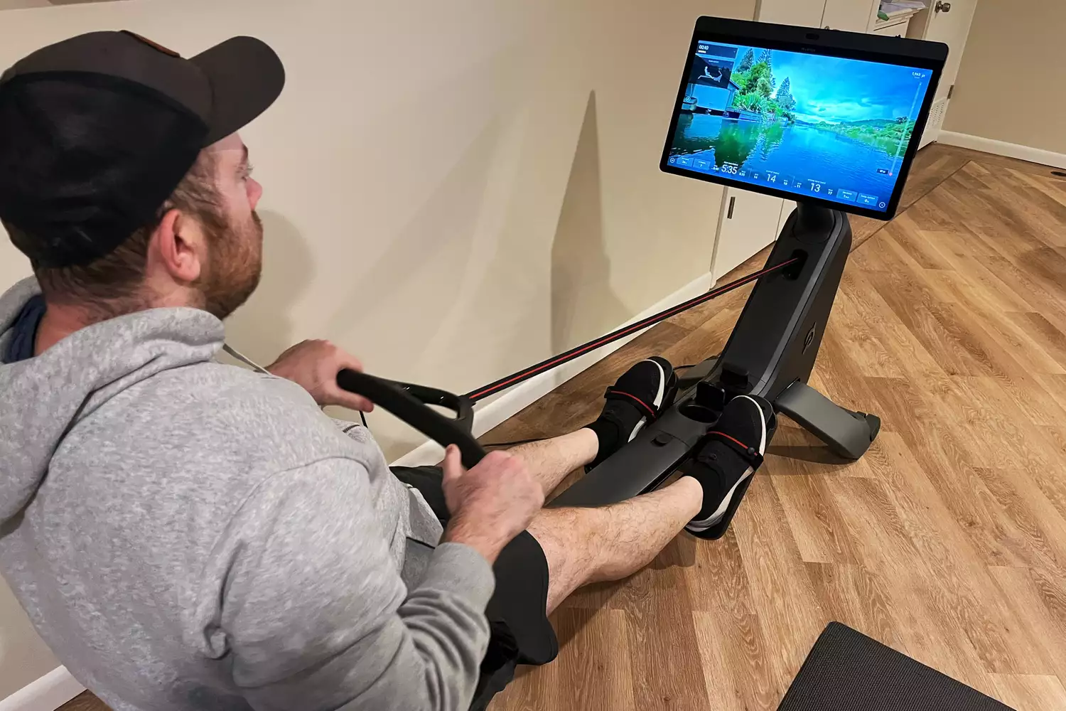 Person pulling the cord on the Peloton Row