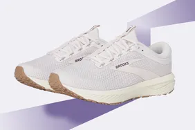 A pair of white Brooks running shoes on a light background showcased for their design