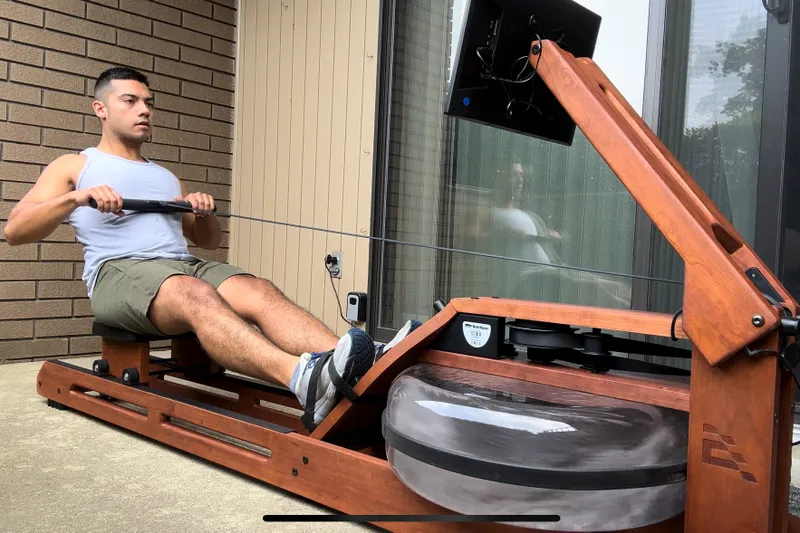 A person uses the Ergatta Rower 