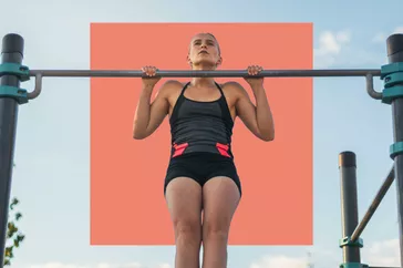 Woman doing a pull up outside