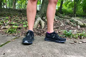 Person wearing On Running Cloudsurfer outside