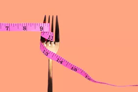 Fork with measuring tape wrapped around it