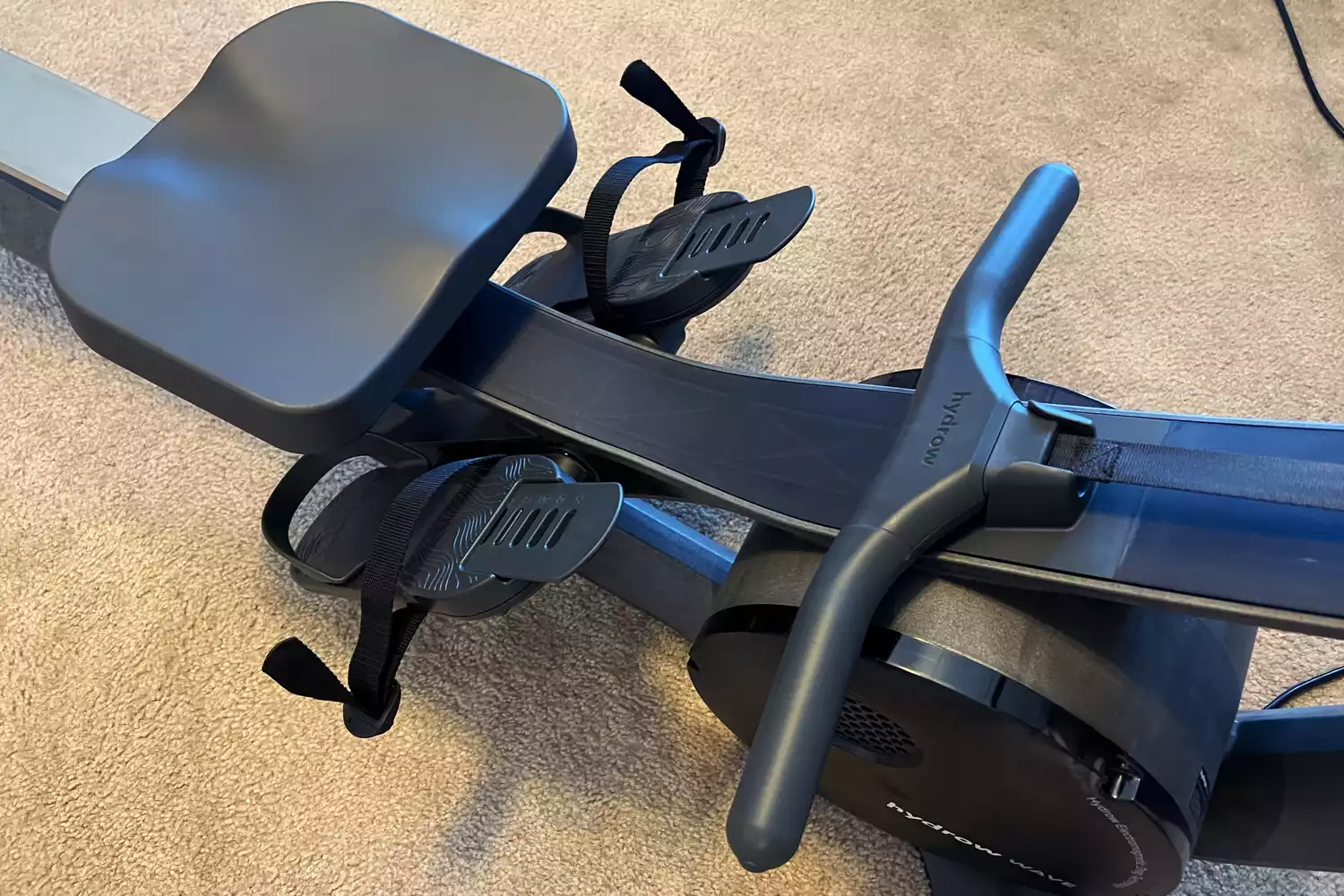 The seat and handles on the Hydrow Wave Rowing Machine