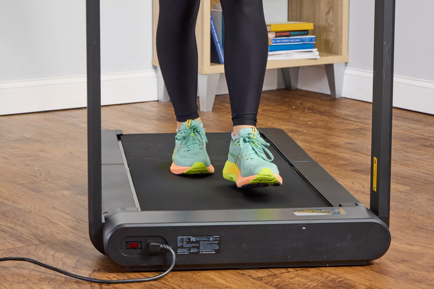 A close up of a person walking on the WalkingPad X21 Double-Fold Treadmill