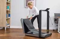 A person unfolding the WalkingPad X21 Double-Fold Treadmill