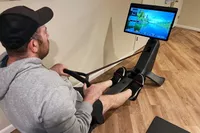 Person pulling the cord on the Peloton Row